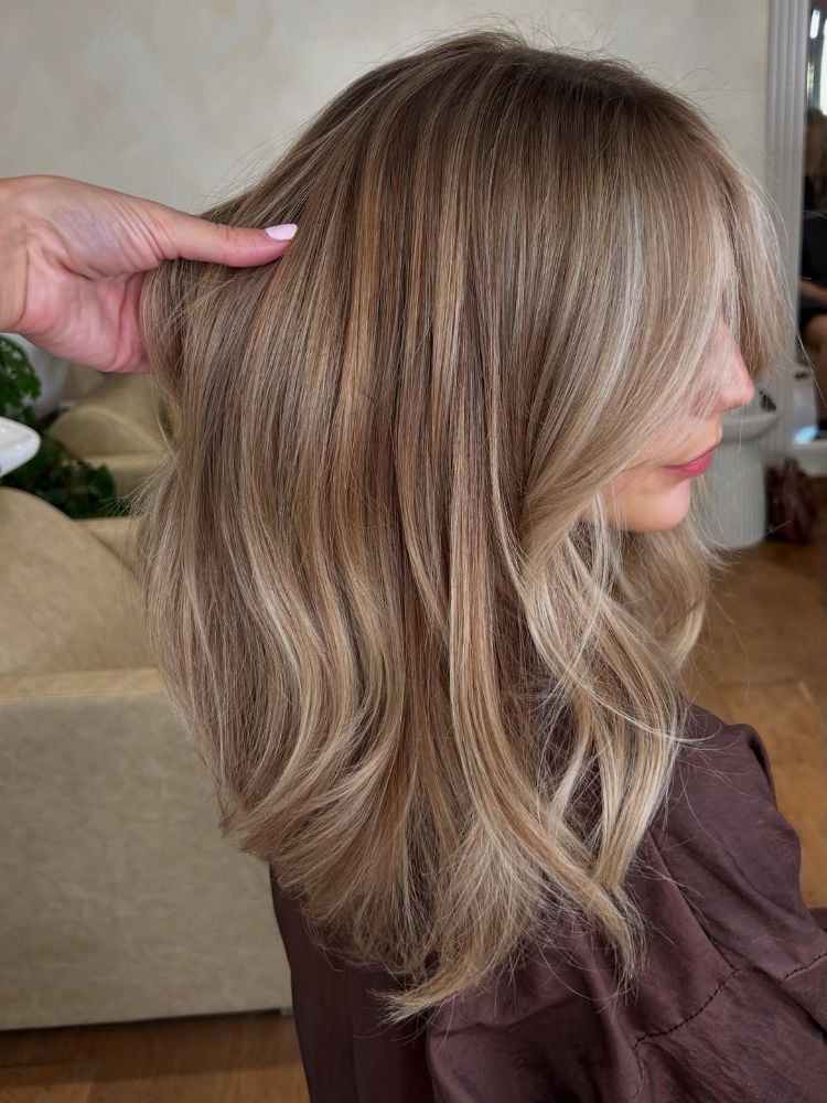 Side View Collarbone Waves With Dimension — Classy Light Brown Hair with Blonde