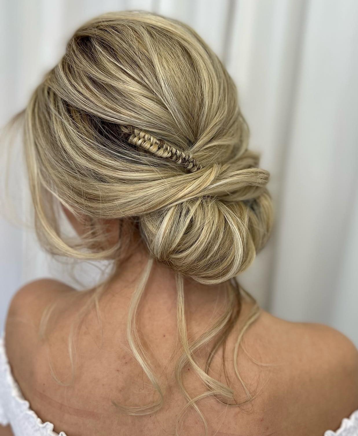 Blonde Twisted Bun Updo With Face-Framing Strands Blonde Twisted Bun Updo With Face-Framing Strands — Classy Loose Updo