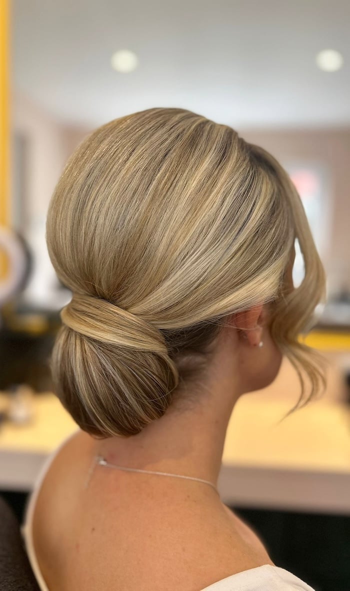 Honey Blonde Twisted Low Bun With Waves Honey Blonde Twisted Low Bun With Waves — Classy Low Bun Wedding Hair