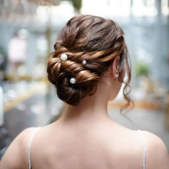 Dark Brown Twisted Updo With Pearl Pins Dark Brown Twisted Updo With Pearl Pins — Classy Low Bun Wedding Hair