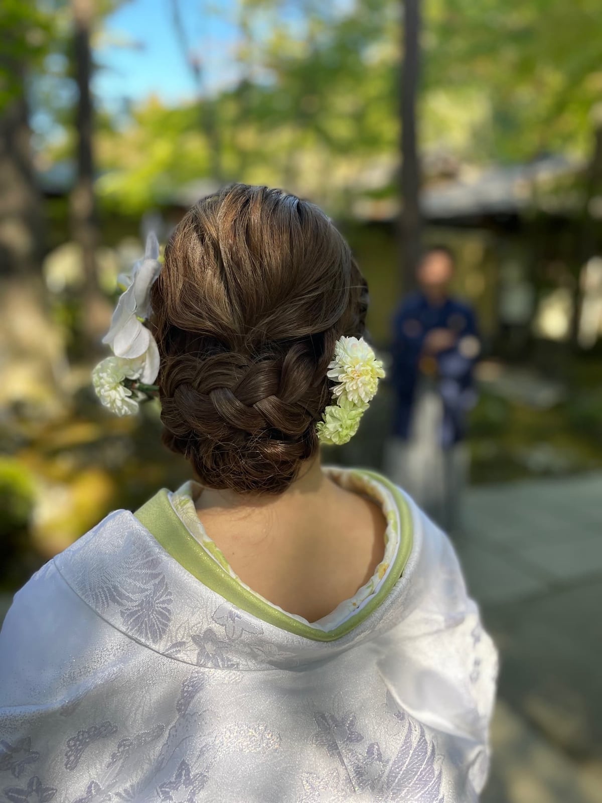 Dark Brown Low Bun With Flowers And Braids Dark Brown Low Bun With Flowers And Braids — Classy Low Bun Wedding Hair
