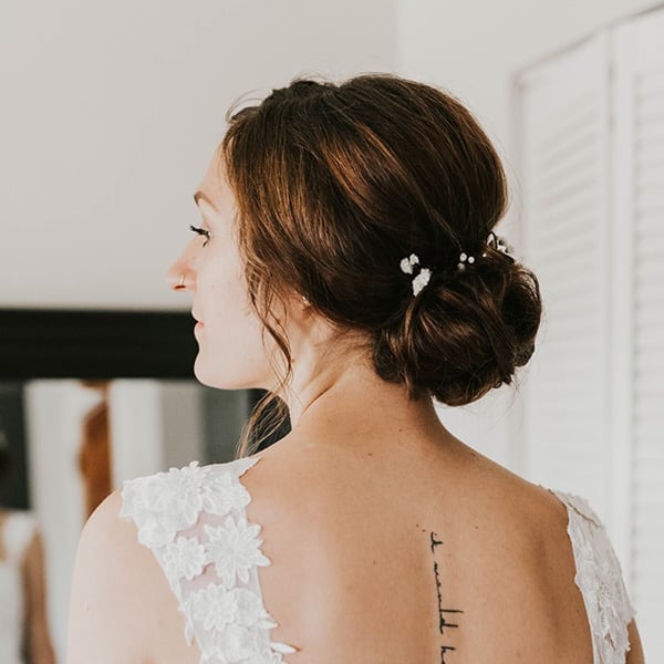 Dark Brown Low Bun With Pearl Pins Dark Brown Low Bun With Pearl Pins — Classy Low Bun Wedding Hair