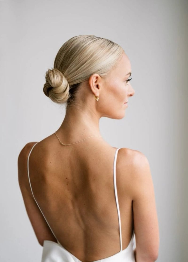 Ash Blonde Sleek Twisted Low Bun Side Part Ash Blonde Sleek Twisted Low Bun Side Part — Classy Low Bun Wedding Hair