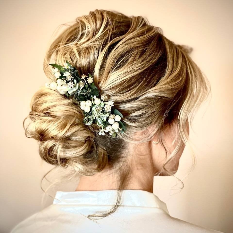 Textured Blonde Low Bun With Floral Accent Textured Blonde Low Bun With Floral Accent — Classy Low Bun Wedding Hair