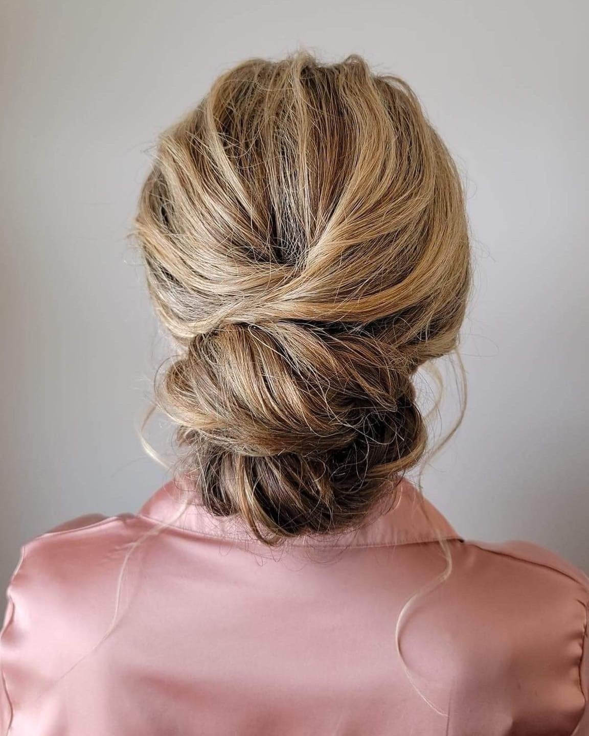 Sleek Dark Brown Low Bun With Blonde With Highlights Sleek Dark Brown Low Bun With Blonde With Highlights — Classy Low Bun Wedding Hair