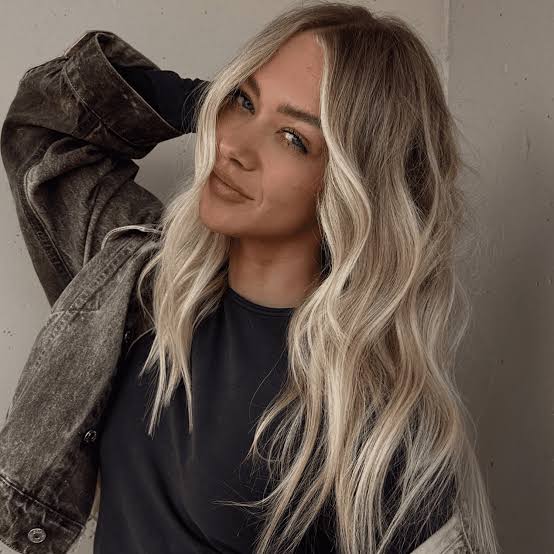 Denim Jacket Over a Grey T-Shirt with Blonde Money Piece Hair — Classy Money Piece
