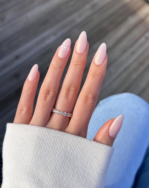 Short Almond Pale Pink Shimmer White Bow Art — Classy Neutral Nails