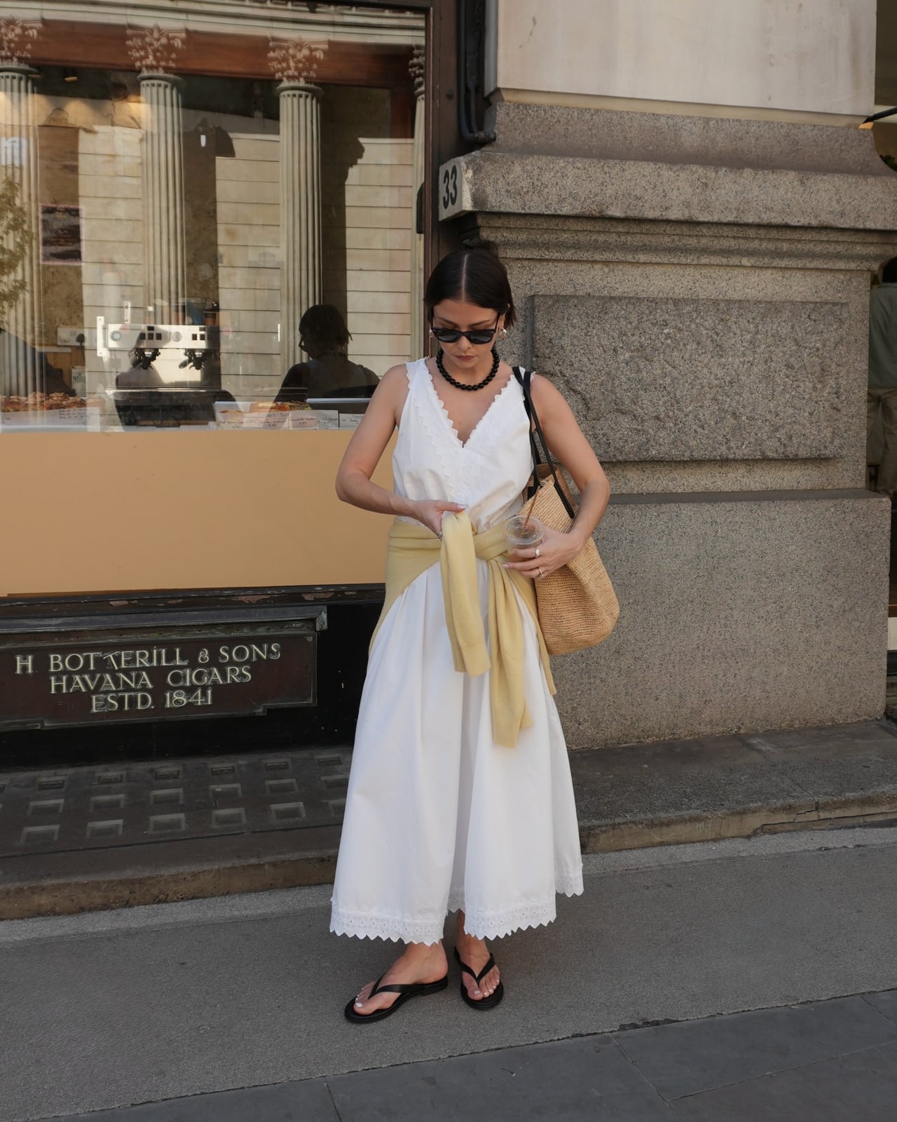 A White Lace-Trimmed Maxi Dress with a Tied Sweater A White Lace-Trimmed Maxi Dress with a Tied Sweater — Classy Outdoor Outfit