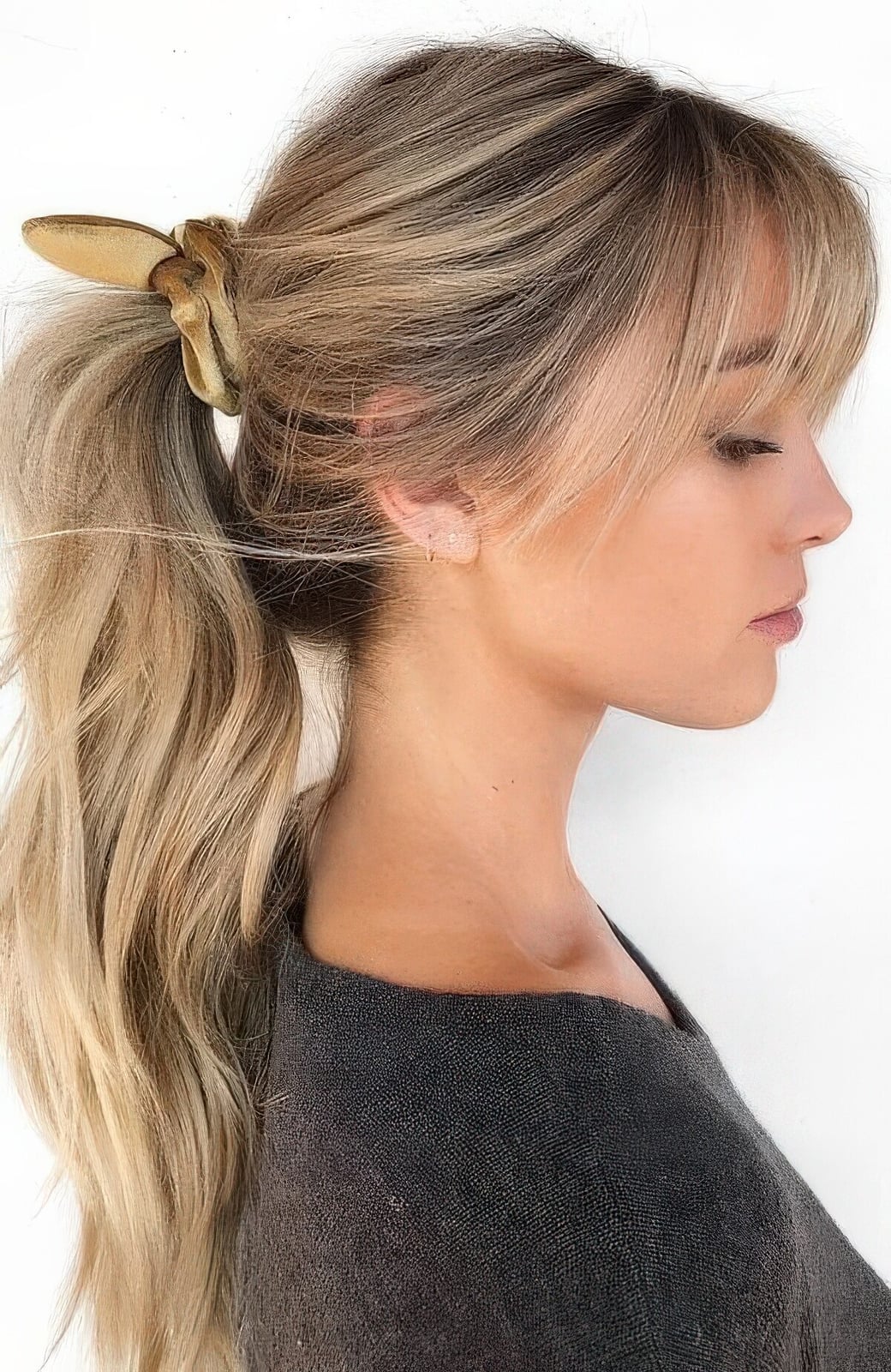 Sleek Collarbone Ponytail With Wispy Bangs — Classy Ponytail with Bangs
