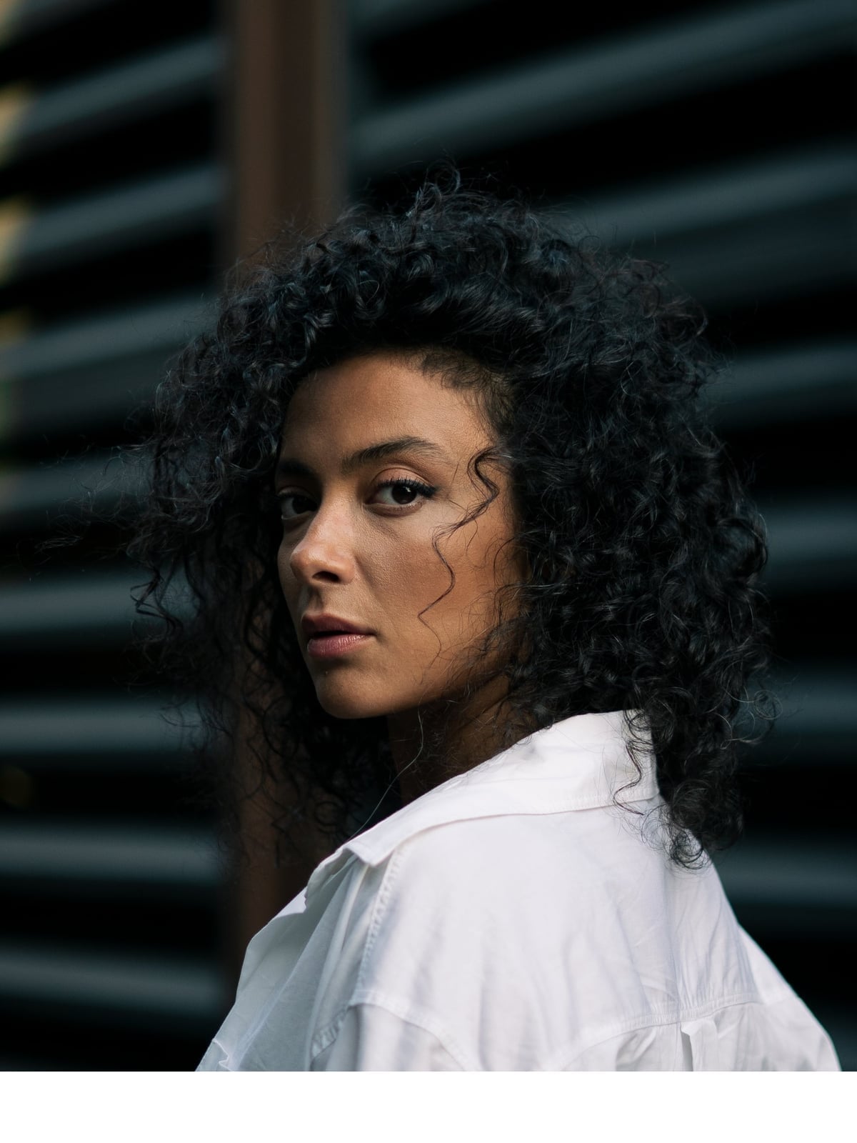 Voluminous Dark Brown Curly Collarbone Cut — Classy Rainy Days Hairstyles