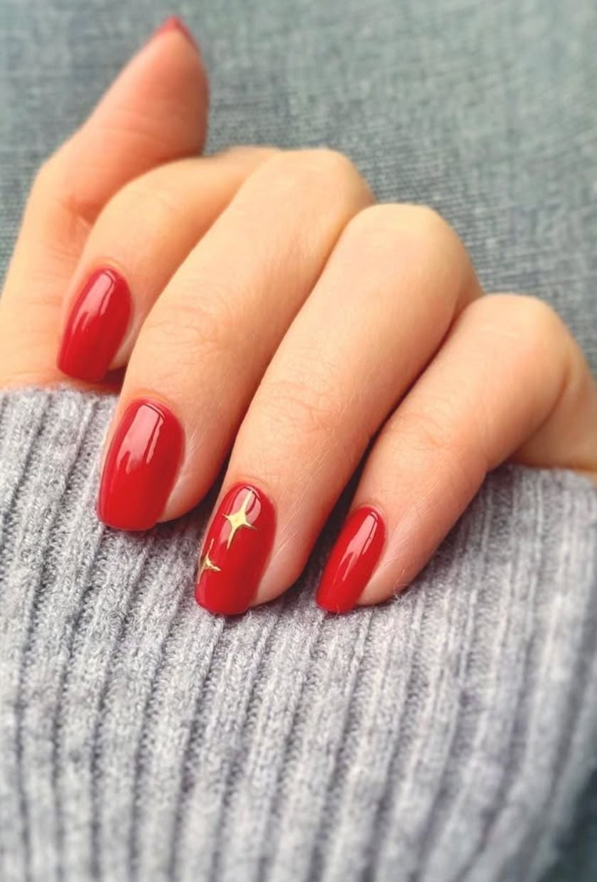 Bright Red Oval Nails With Gold Star Accent — Classy Red Nails