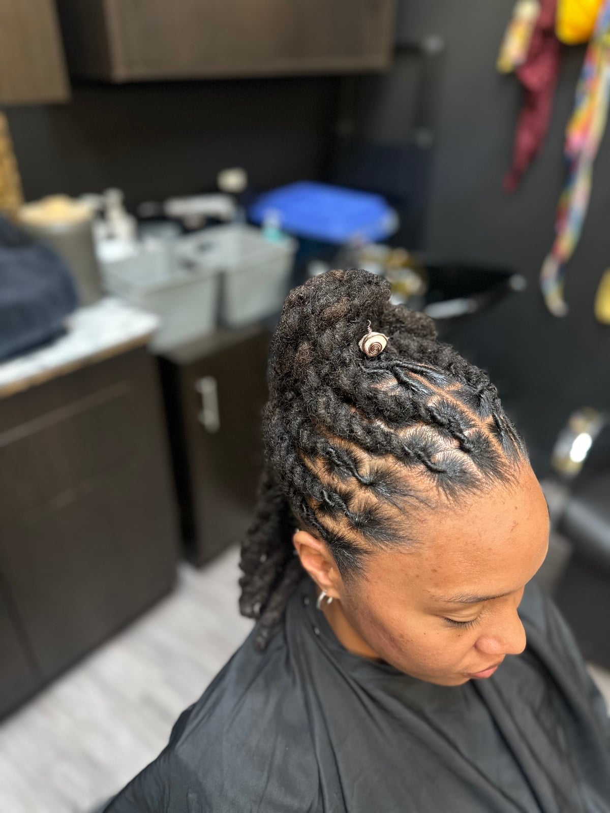 Shoulder Two-Strand Twists Updo With Neat Parting Shoulder Two-Strand Twists Updo With Neat Parting — Classy Retwist Locs