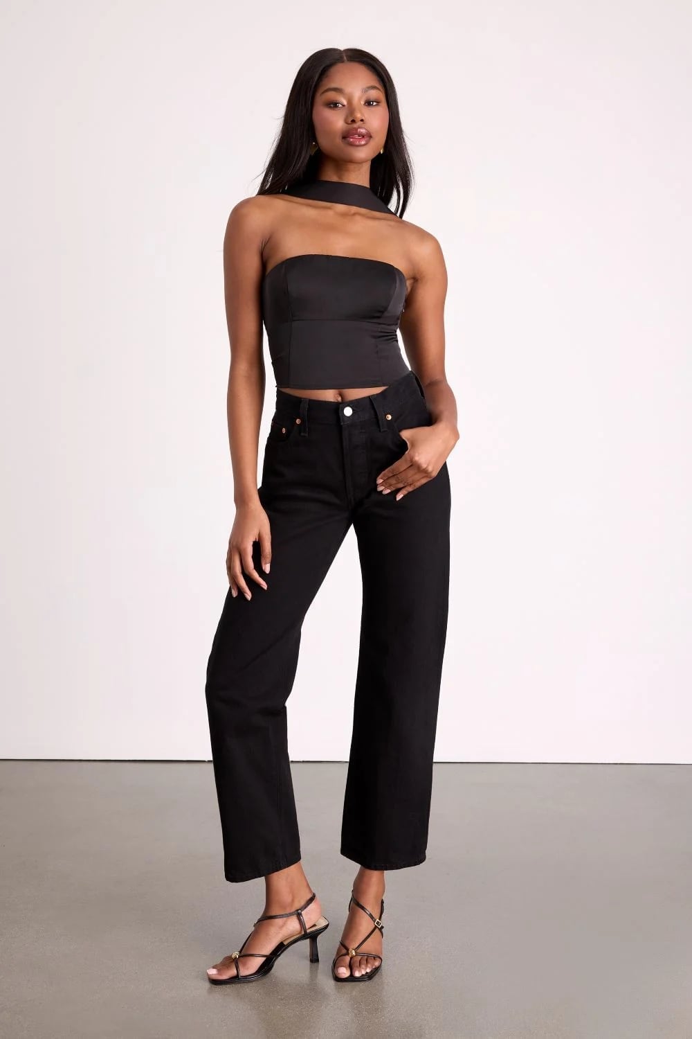 Black Strapless Top with Straight-Leg Jeans — Classy Rock Concert Outfits