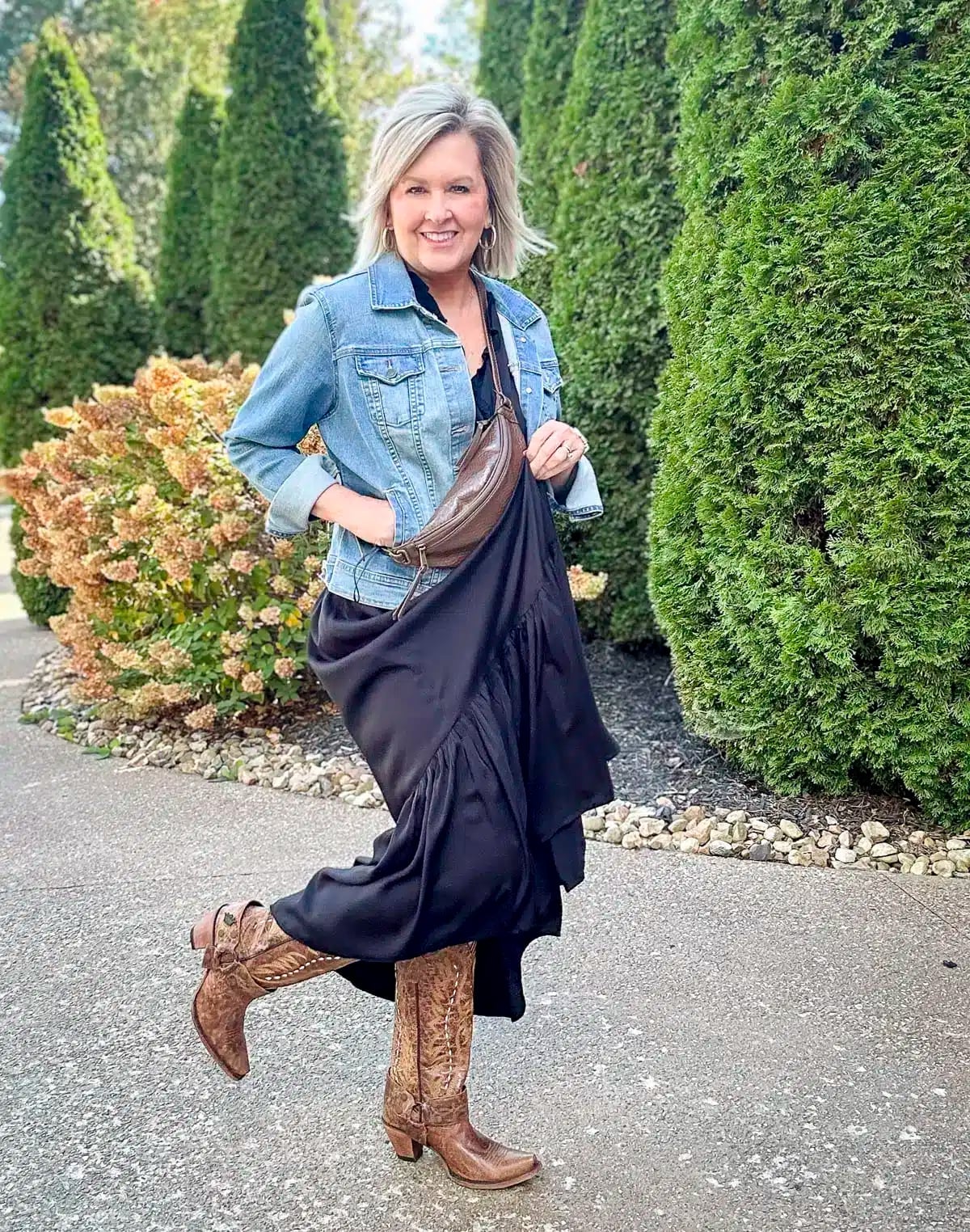 Denim Jacket Over Black Maxi Dress with Cowboy Boots — Classy Rock Concert Outfits