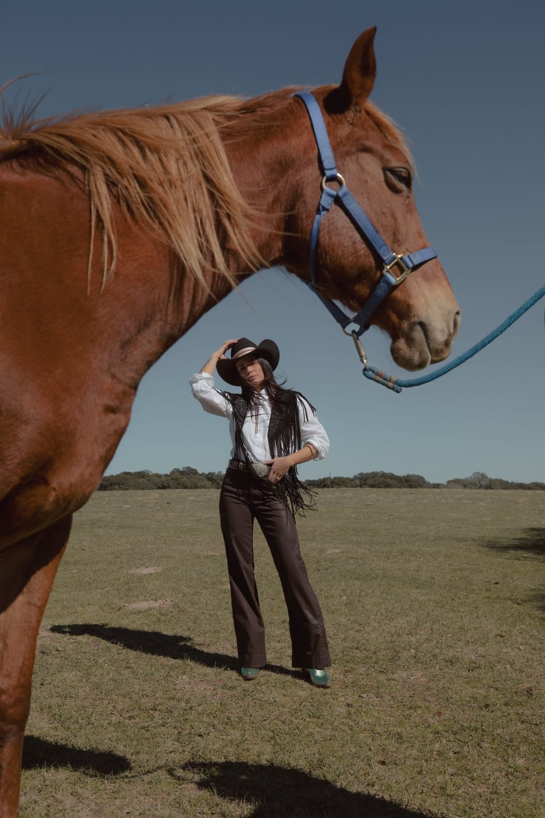 Fringed Vest With Flared Jeans And Teal Boots — Classy Rodeo Outfits for Women