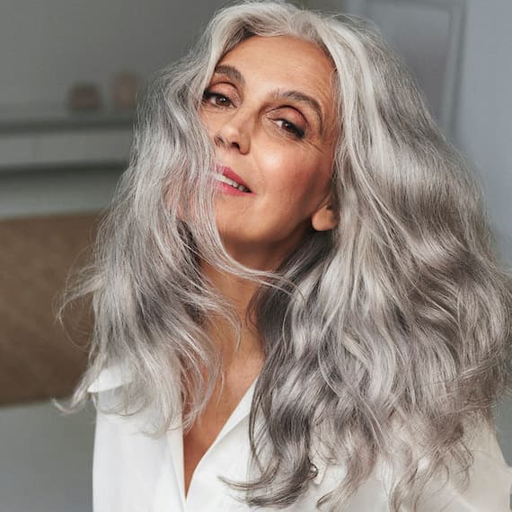 Mid-Back Layers With Wavy Blowout Mid-Back Layers With Wavy Blowout — Classy Salt and Pepper Hair
