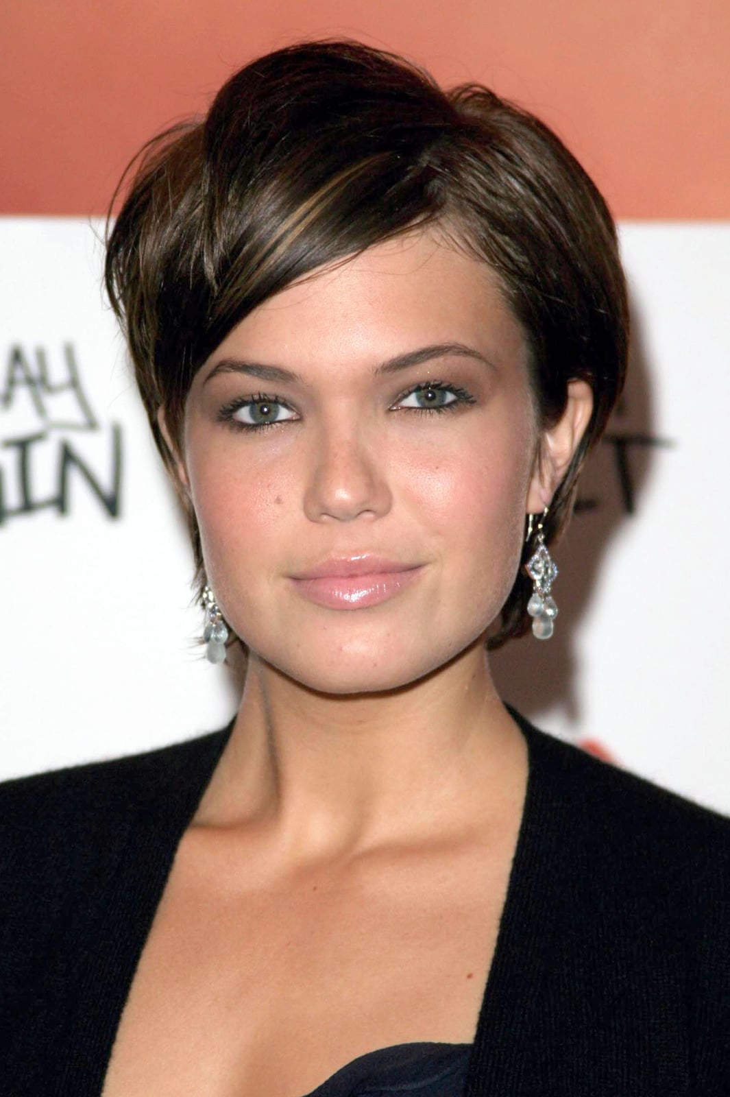 Asymmetrical Dark Brown Pixie With Textured Sweep and Side-Swept Bangs Asymmetrical Dark Brown Pixie With Textured Sweep and Side-Swept Bangs — Classy Short Haircuts for Round Faces