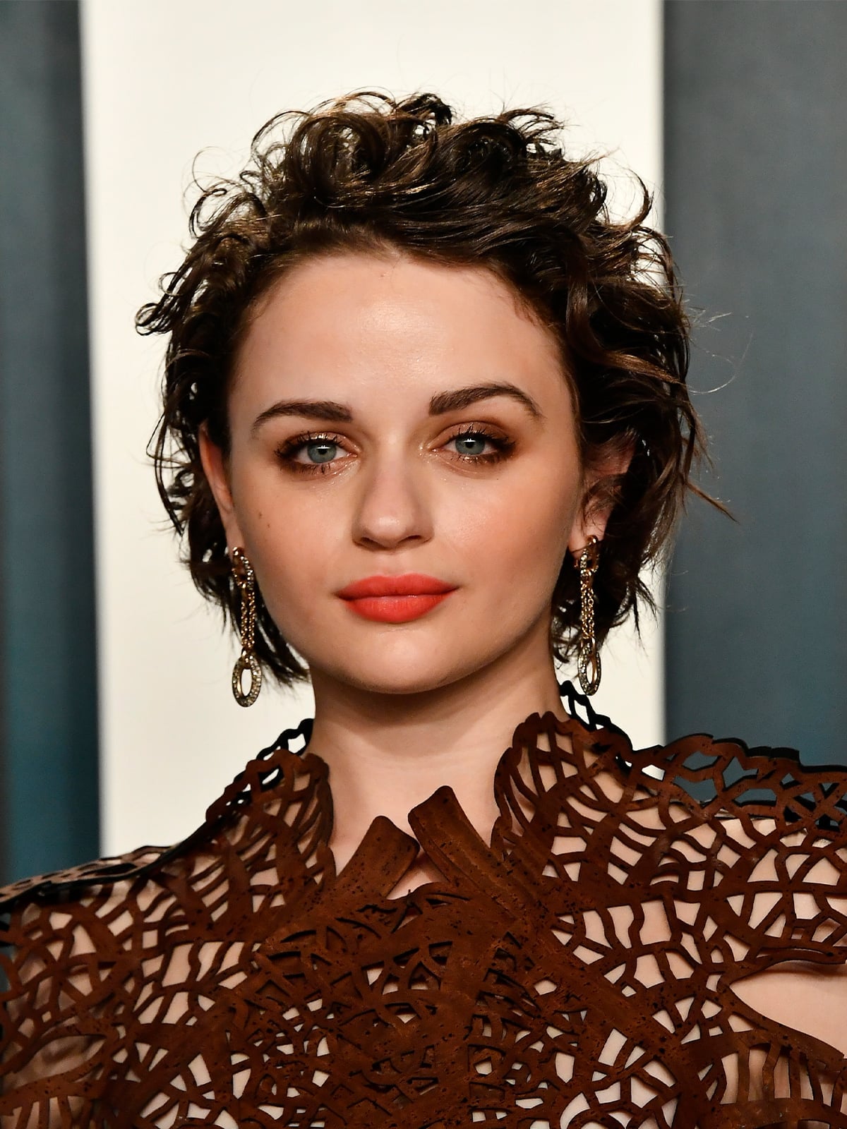 Edgy Dark Brown Pixie With Wet Look Edgy Dark Brown Pixie With Wet Look — Classy Short Haircuts for Round Faces