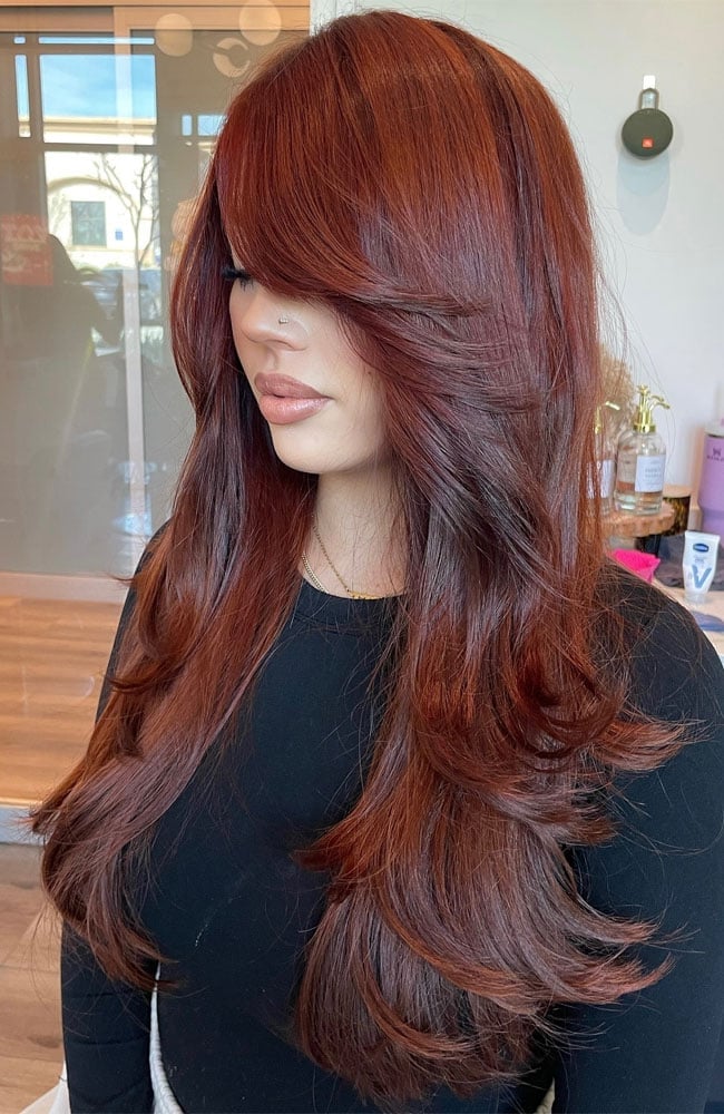 Mid-Back Auburn Layers With Voluminous Bangs Mid-Back Auburn Layers With Voluminous Bangs — Classy Side Bangs