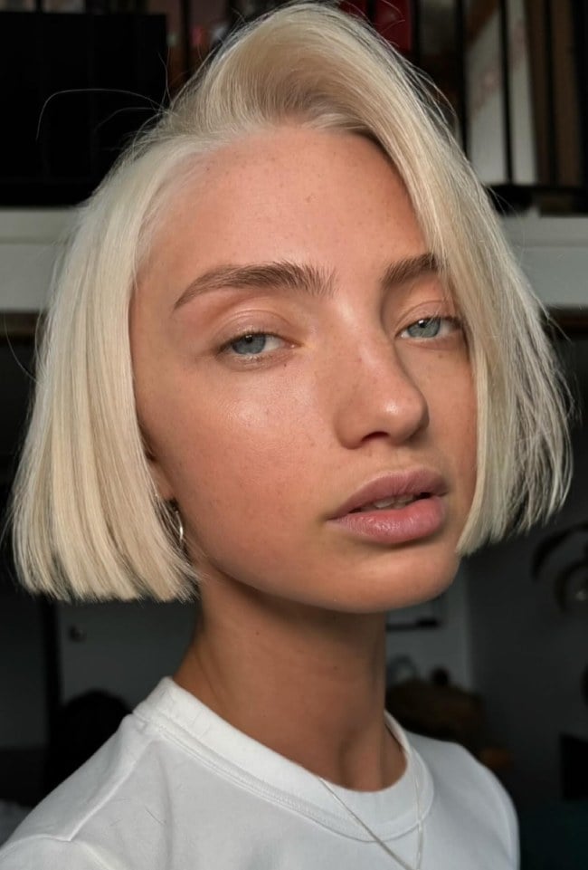 Platinum Blonde Bob With Blunt Bangs — Classy Side Part Bob