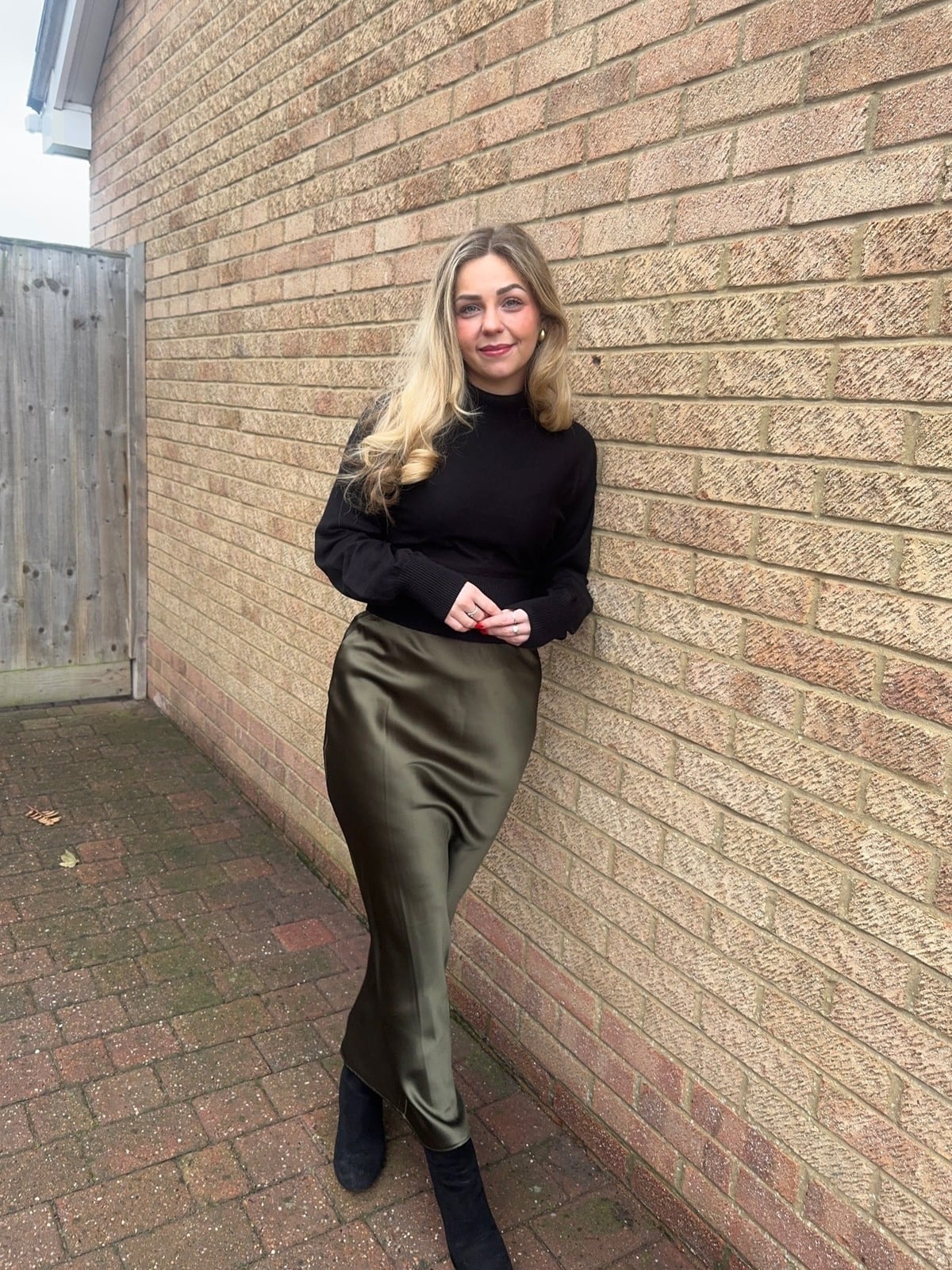 Olive Green Satin Midi Skirt with a Black Mock Neck Sweater Olive Green Satin Midi Skirt with a Black Mock Neck Sweater — Classy Silk Skirt Outfit