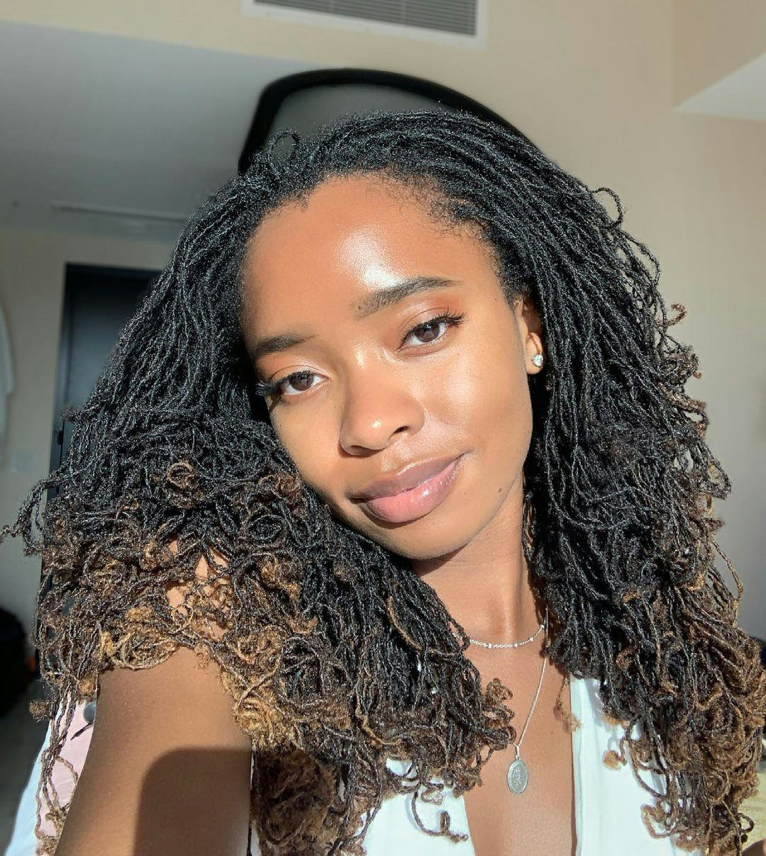 Shoulder Wavy Locs With Subtle Brown Highlights Shoulder Wavy Locs With Subtle Brown Highlights — Classy Sister Locs