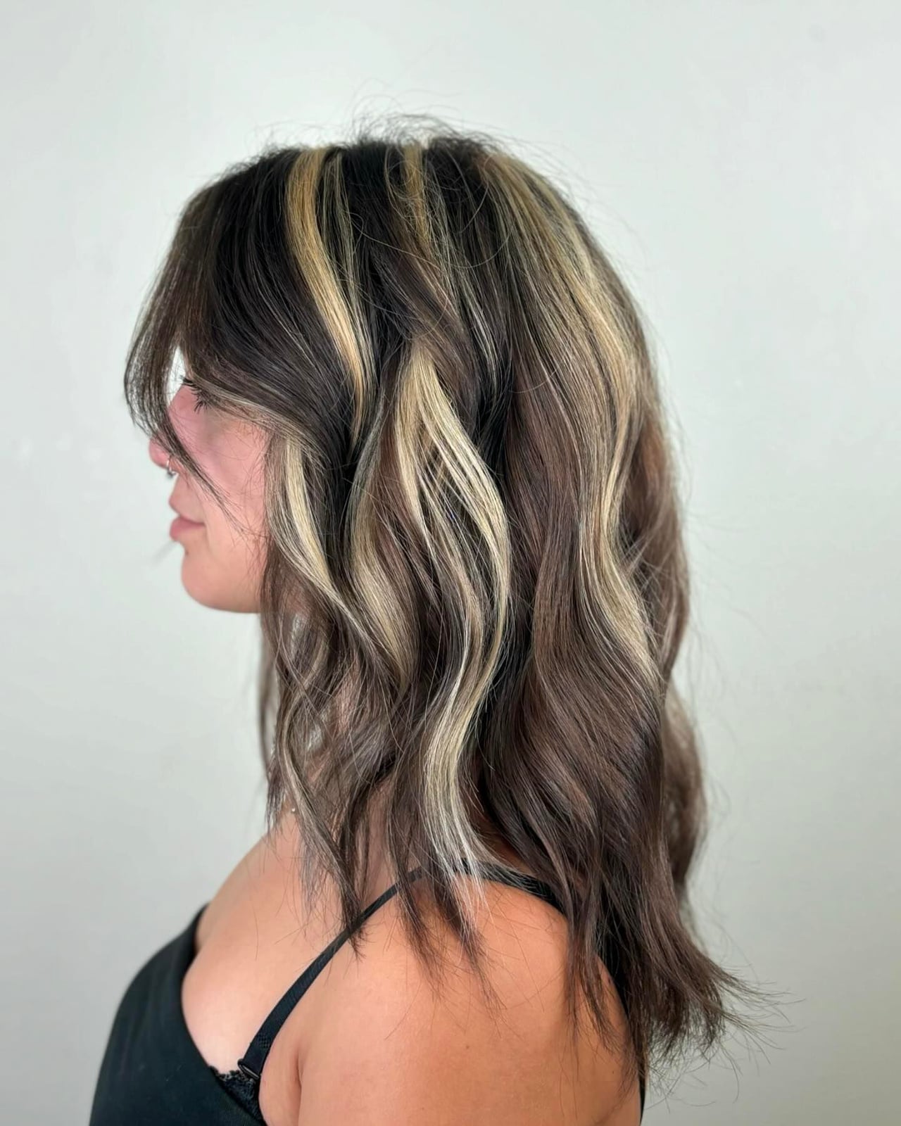 Mid-Back Wavy Dark Brown With Blonde Stripes Side View Mid-Back Wavy Dark Brown With Blonde Stripes Side View — Classy Skunk Stripe Hair