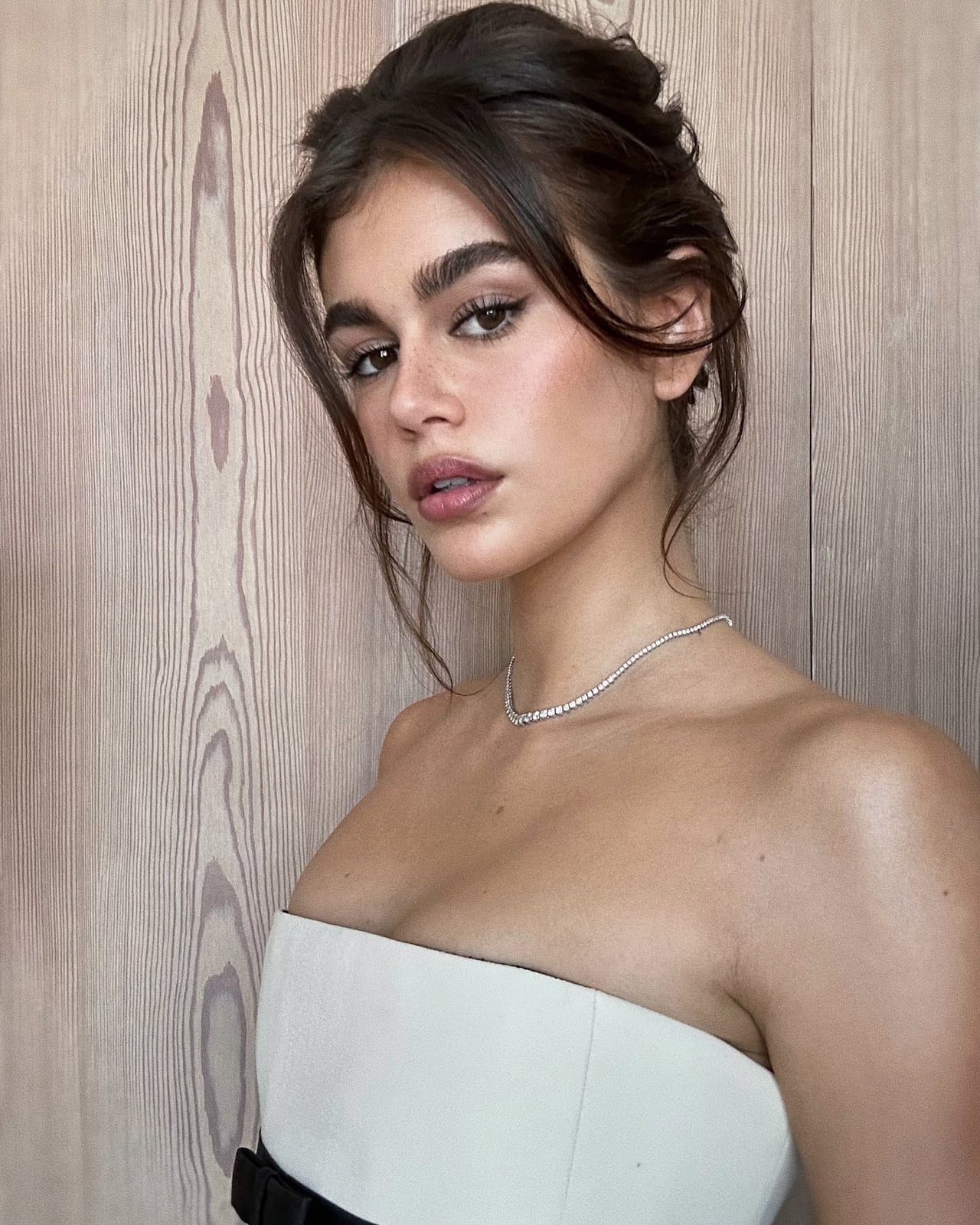 Polished Sleek Updo With Middle Part — Classy Strapless Dresses Hairstyles