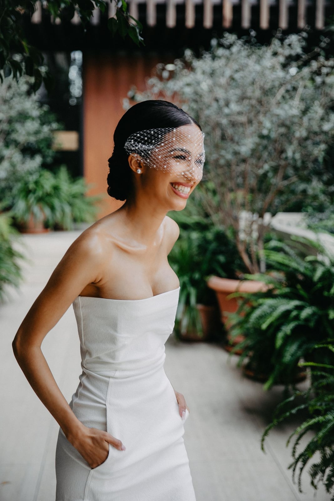 Sleek Dark Brown Updo With Birdcage Veil — Classy Strapless Dresses Hairstyles