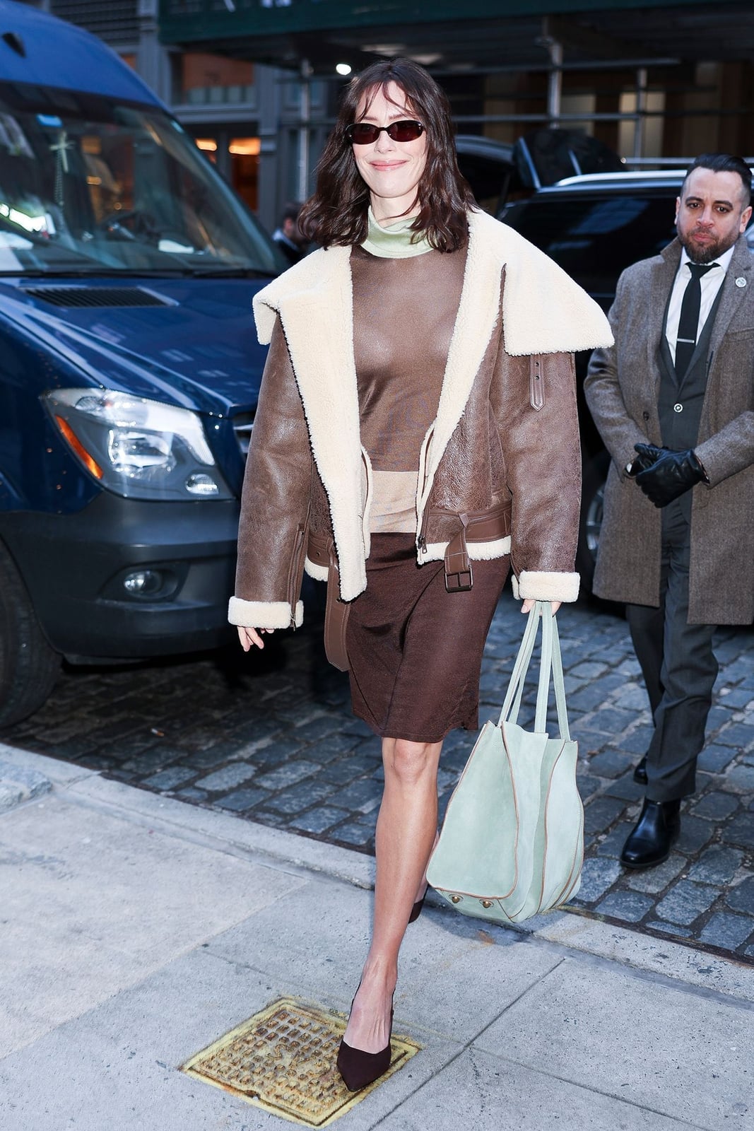 Brown Aviator Jacket with Shearling Collar Over Sheer Top and Skirt — Classy Suede Jacket Outfits