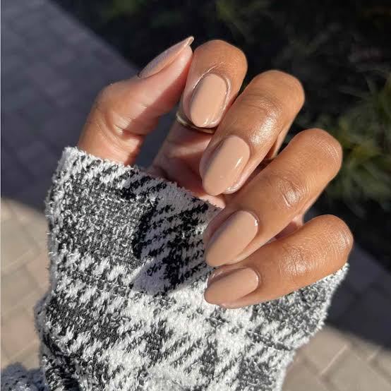 Uniform Tan Glossy Medium Almond Nails, Close-Up Take Uniform Tan Glossy Medium Almond Nails, Close-Up Take — Classy Tan Nails