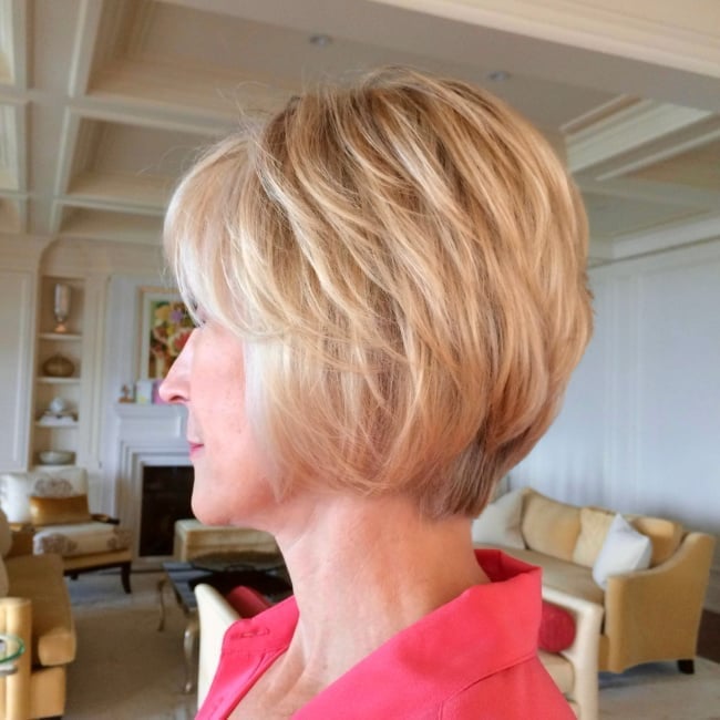Chin-Length Layered Bob With Side-Swept Bangs and Smooth Layers Chin-Length Layered Bob With Side-Swept Bangs and Smooth Layers — Classy Trending Hairstyle