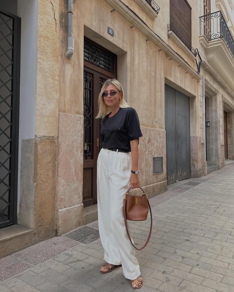 White Wide-Leg Trousers with Black T-Shirt and Brown Handbag White Wide-Leg Trousers with Black T-Shirt and Brown Handbag — Classy Trouser Outfits