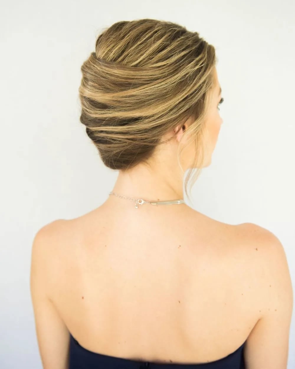 Honey Blonde Twisted Chignon With Darker Roots — Classy Twist Hairstyles