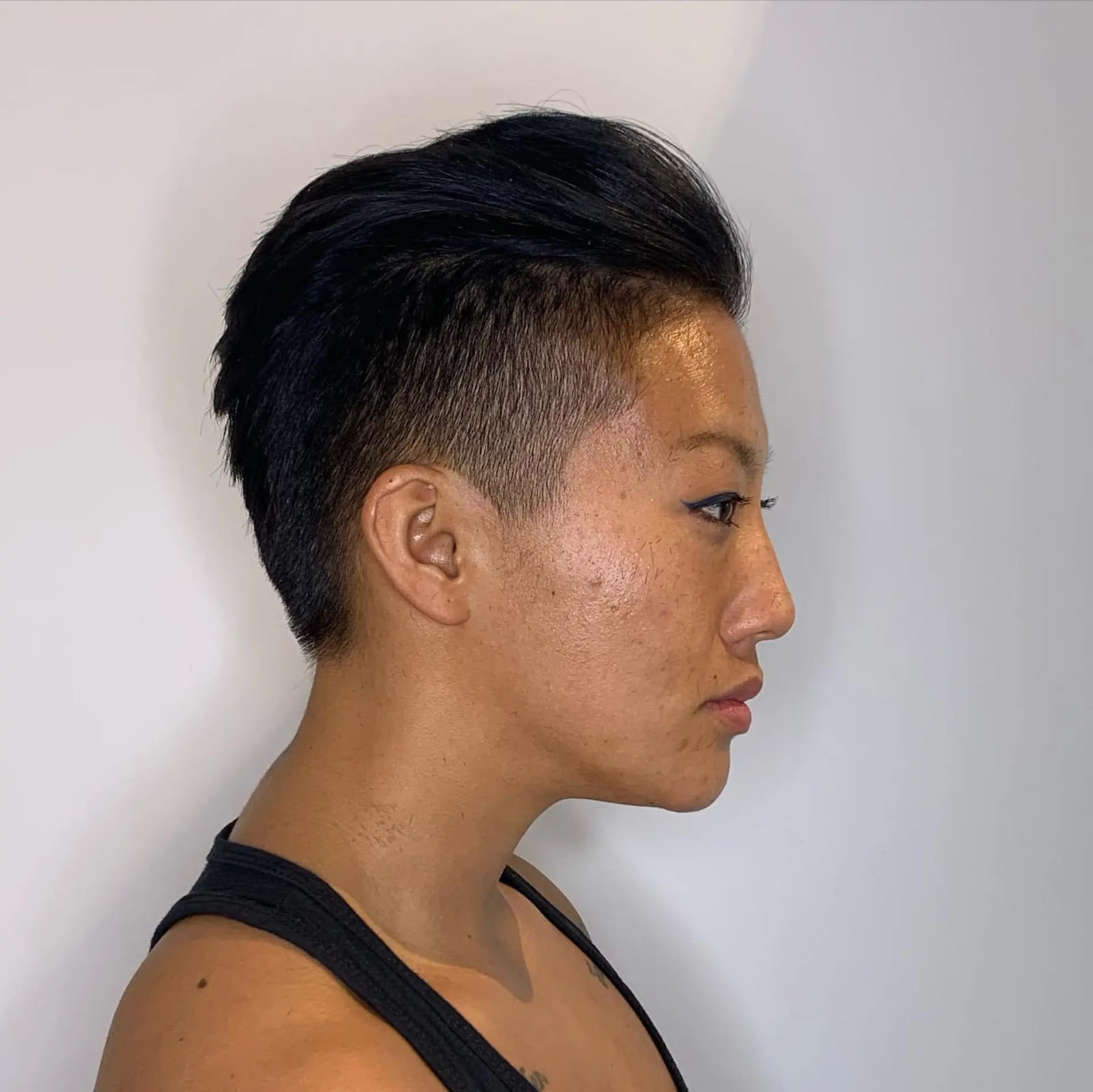 Sharp Black Pixie With Slicked Back Styling And Undercut Sharp Black Pixie With Slicked Back Styling And Undercut — Classy Undercut Pixie
