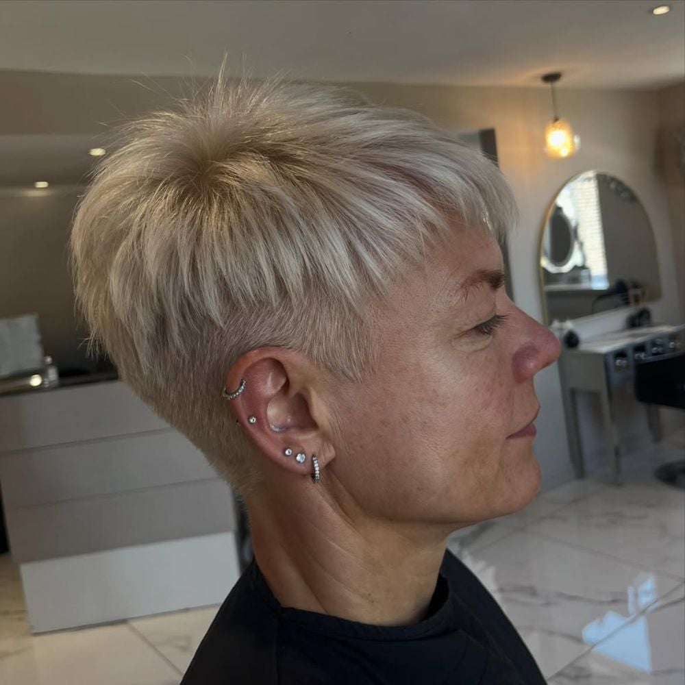 Ash Blonde Pixie With Tapered Undercut And Smooth Layers Ash Blonde Pixie With Tapered Undercut And Smooth Layers — Classy Undercut Pixie