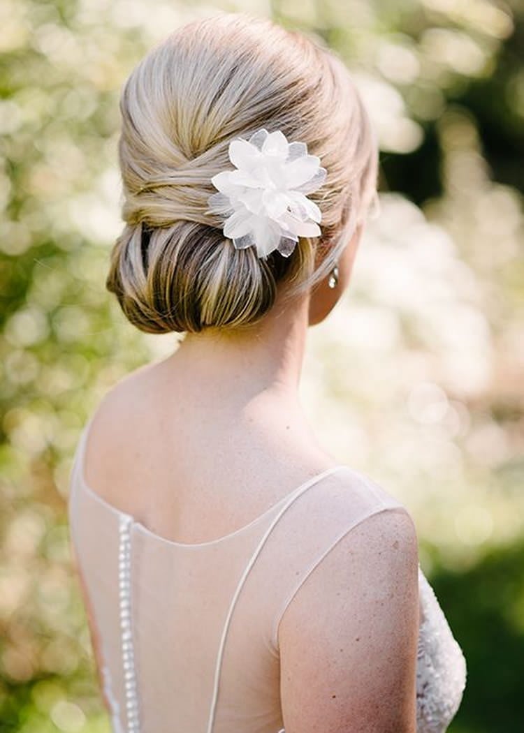 Blonde Collarbone Twisted Low Bun with Flower, Close-Up Take — Classy Updo Hair