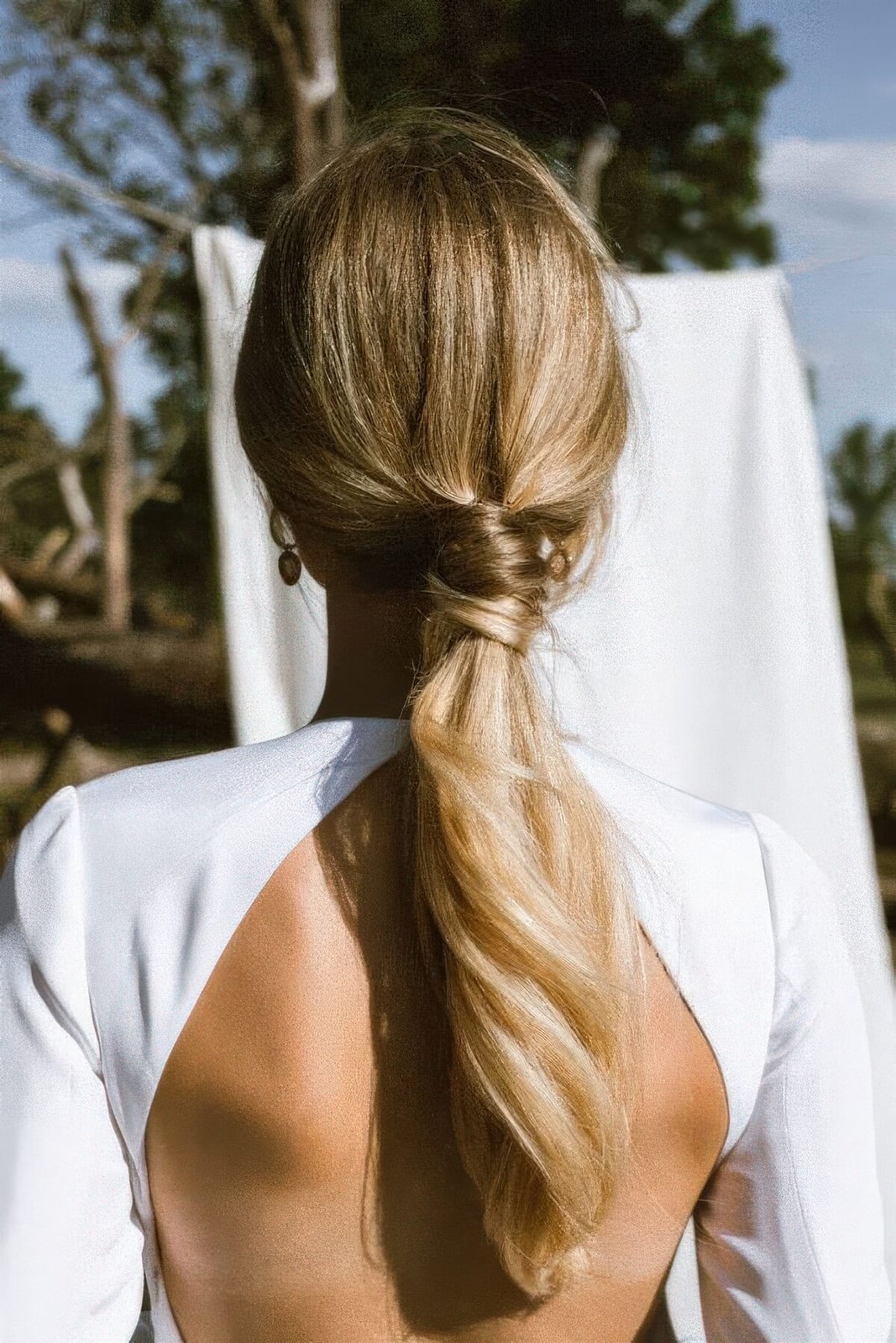 Blonde High Ponytail With Rhinestone Embellishments — Classy Updo Ponytail