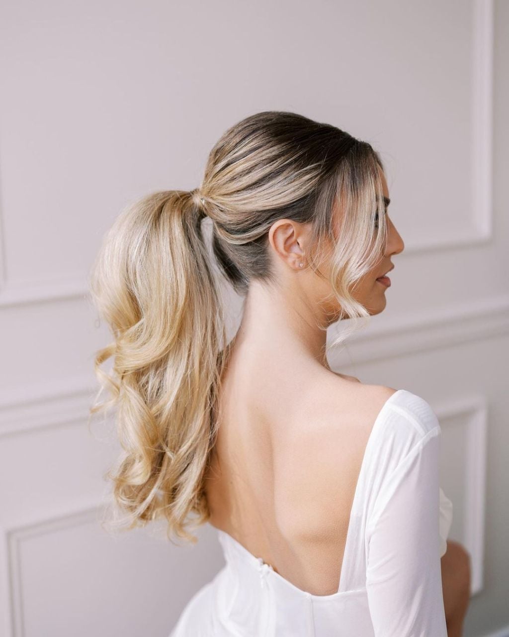Voluminous Blonde Ponytail With Curtain Bangs — Classy Updo Ponytail