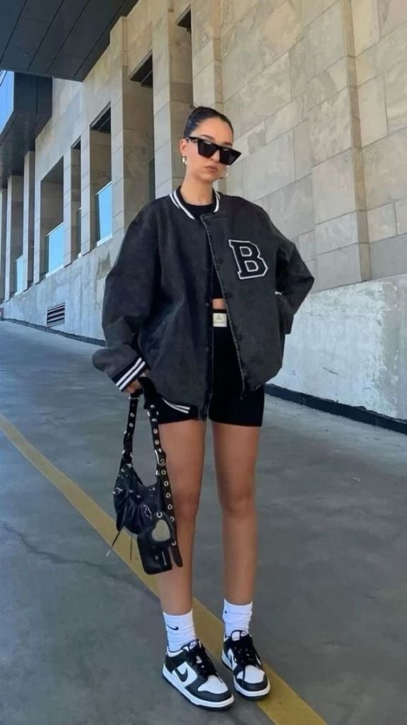 Grey Denim Varsity Jacket with Black Crop Top and Athletic Shorts Grey Denim Varsity Jacket with Black Crop Top and Athletic Shorts — Classy Varsity Jacket Outfits