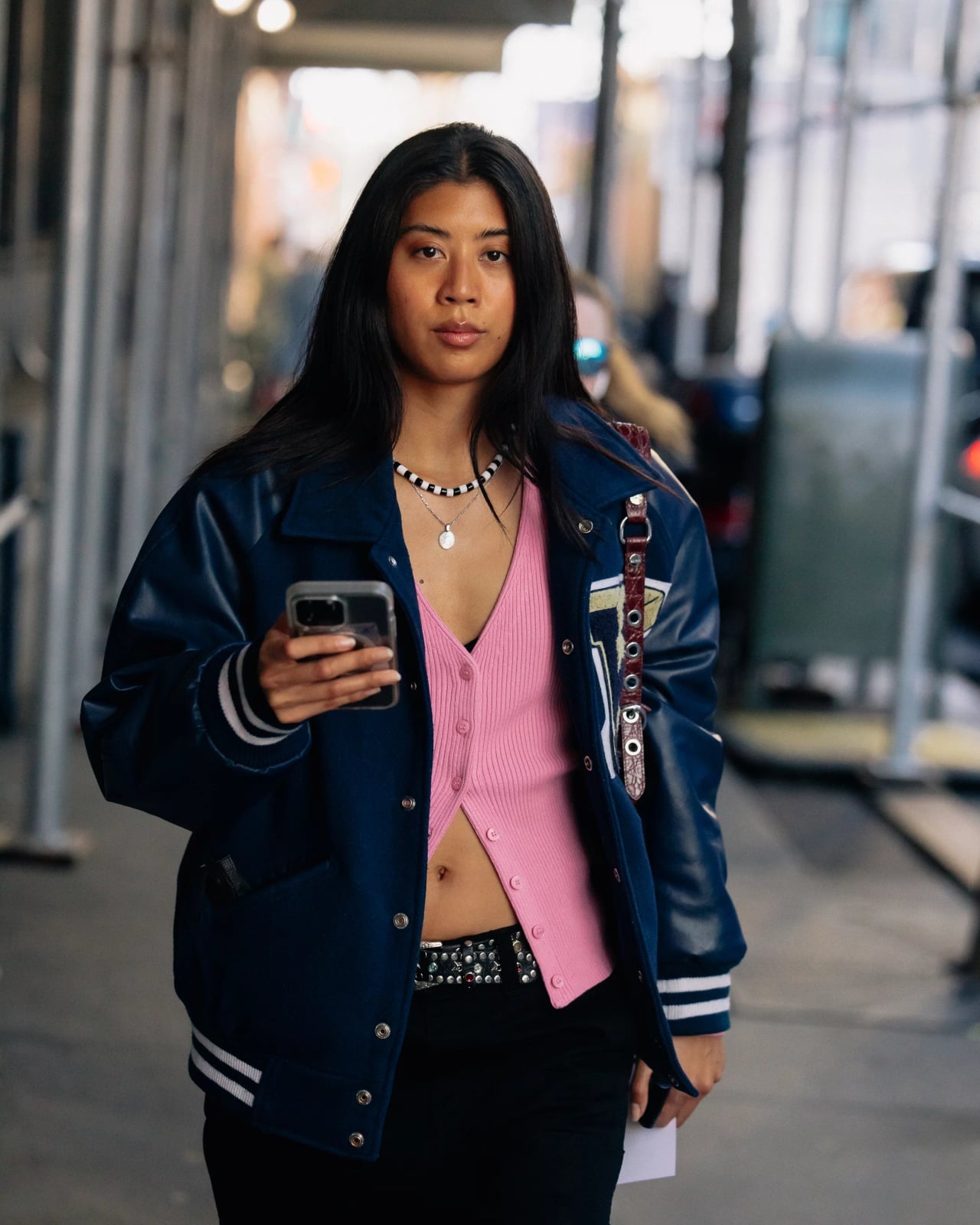 Navy Varsity Jacket Over Pink Cardigan with Black Pants Navy Varsity Jacket Over Pink Cardigan with Black Pants — Classy Varsity Jacket Outfits