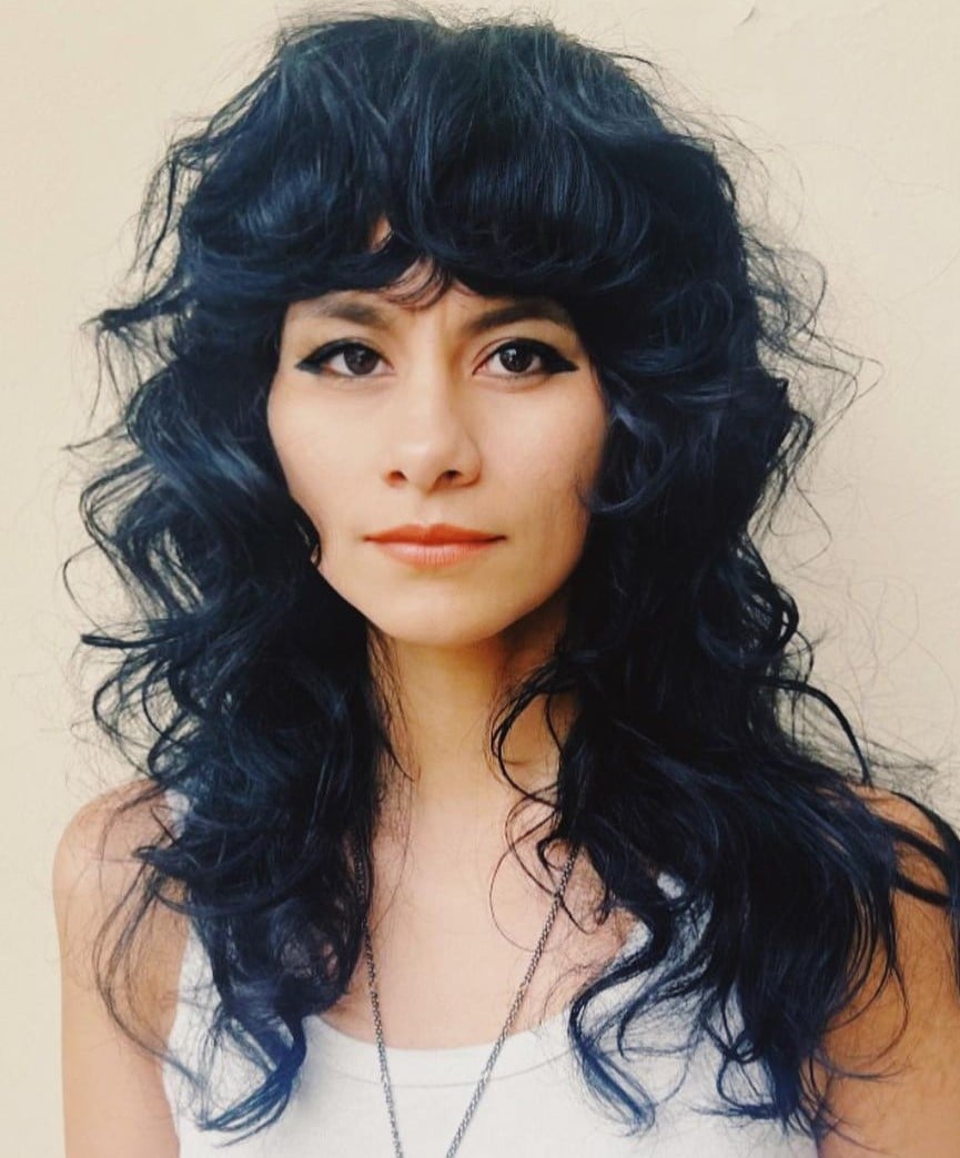 Collarbone Wolf Cut With Wispy Bangs Collarbone Wolf Cut With Wispy Bangs — Classy Wolf Cut Curly Hair