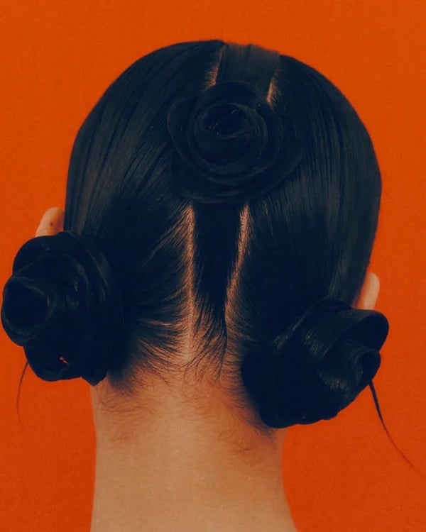 Black Rose-Shaped Low Buns Black Rose-Shaped Low Buns — Classy Y2K Updo