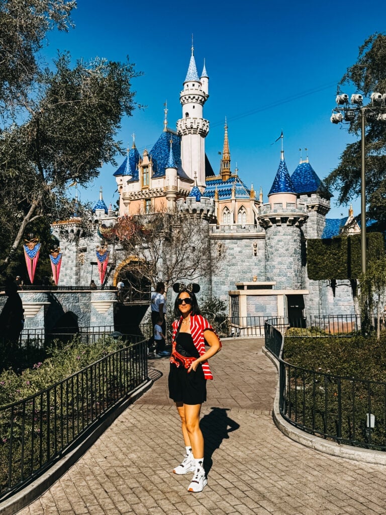 Striped Cardigan Over Black Dress — Cute Disney Outfit Inspo