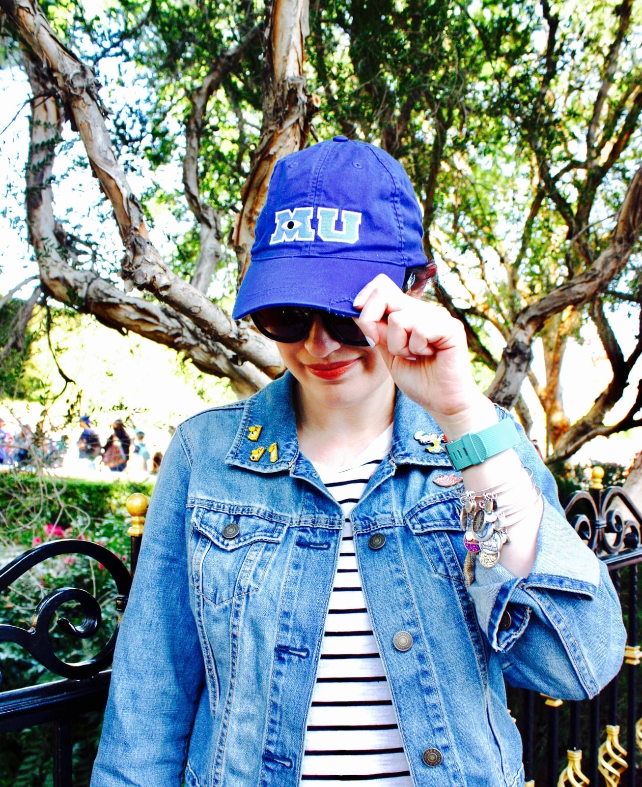 Denim Jacket With Character Pins and Baseball Cap — Cute Disney Outfit Inspo