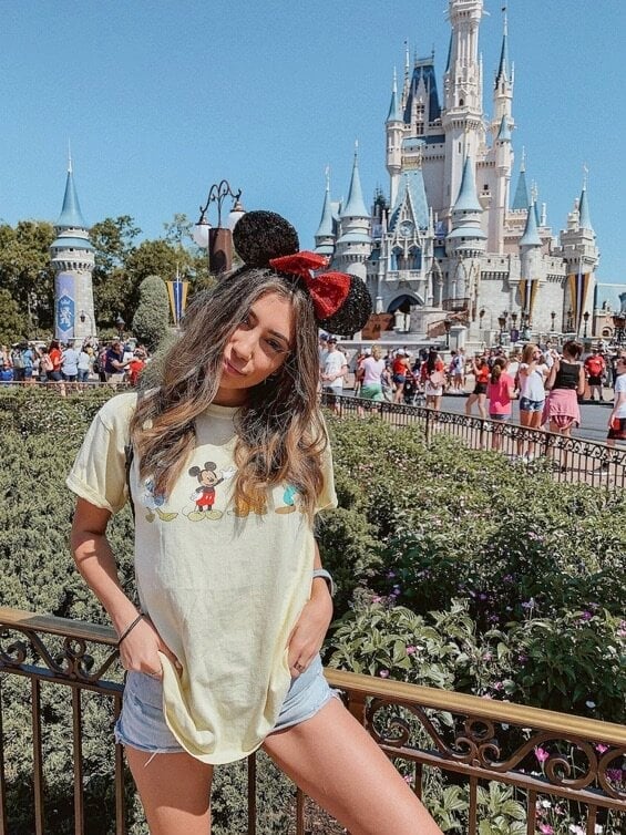 Yellow Graphic Tee With Denim Shorts — Cute Disney Outfit Inspo