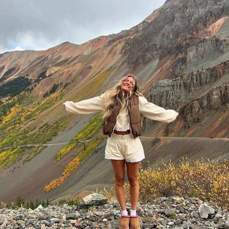 Puffer Vest With Cream Top And White Shorts — Cute Hiking Outfit Inspo