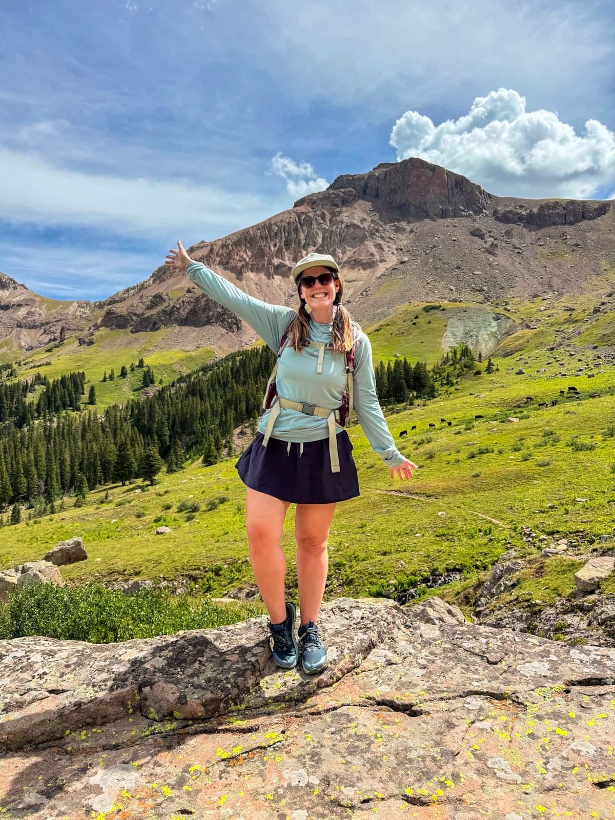 Light Blue Top With Navy Skort For A Mountain Hike — Cute Hiking Outfit Inspo