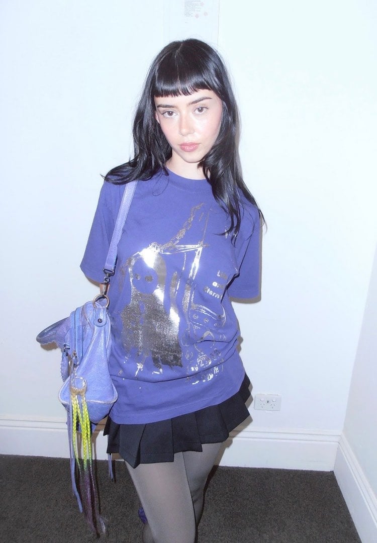 Purple Graphic T-Shirt With Black Pleated Mini Skirt — Cute Purple Outfits