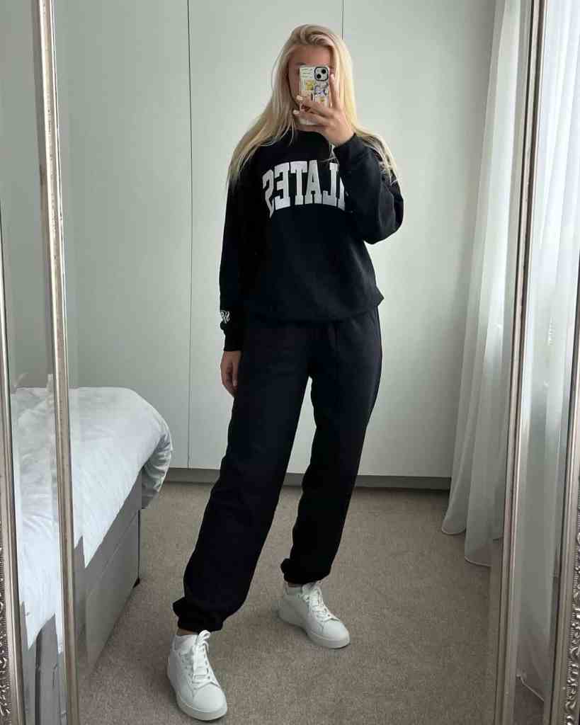 Black Oversized Sweatpants With Graphic Hoodie, Close-Up Take — Cute Sweatpants Outfit Inspo